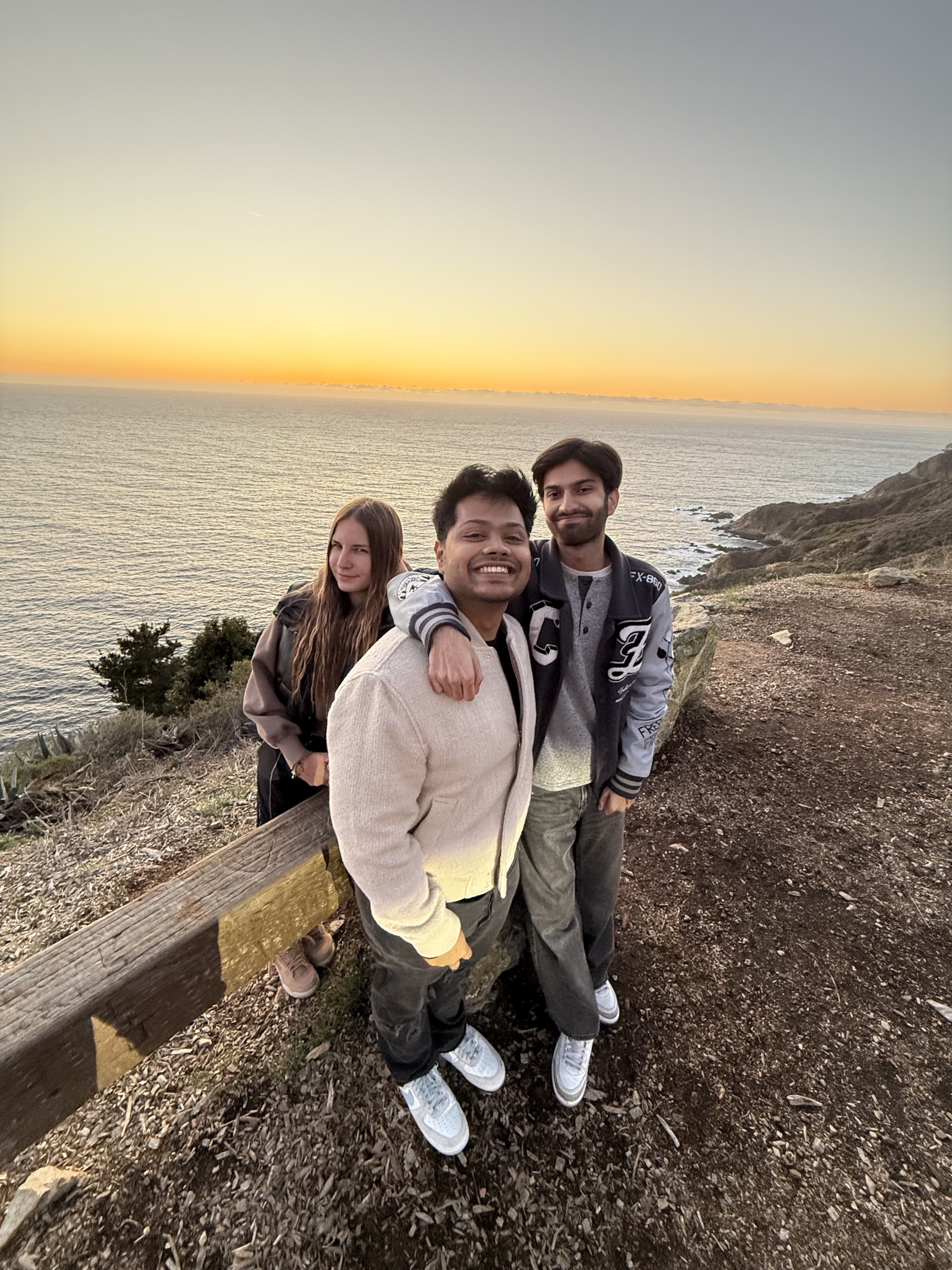 Friends standing together at a viewpoint