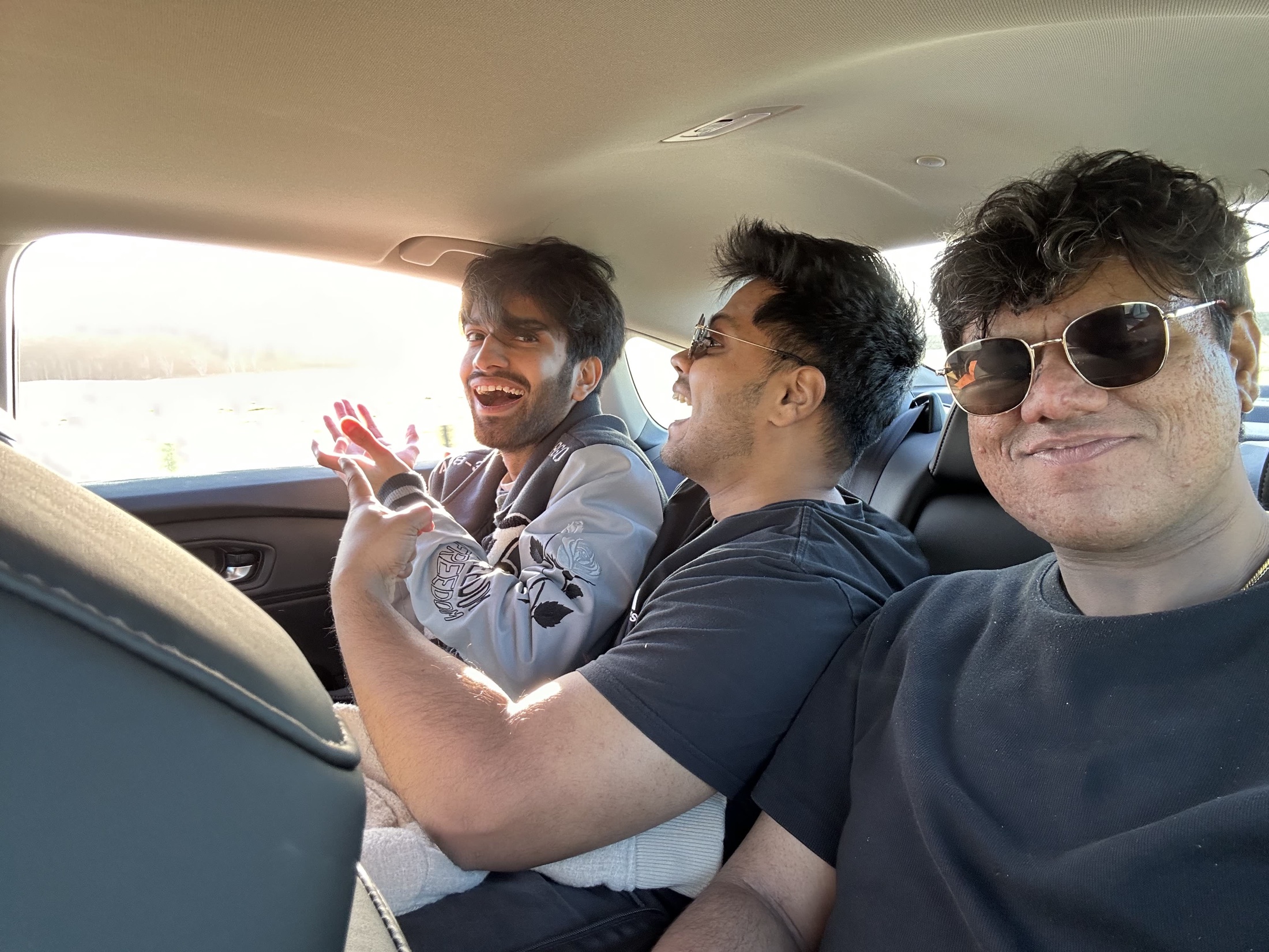 Friends in the back seat of a car