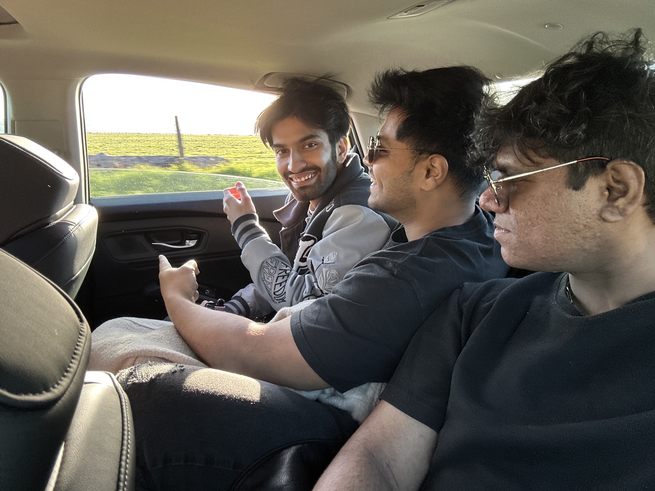 Friends sitting together in a car